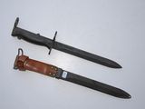 two knives are laying side by side on a white surface
