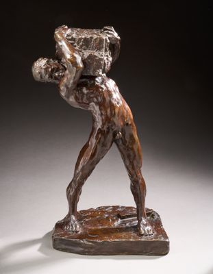 an image of a bronze statue of a man holding a basket