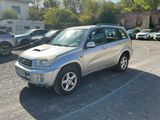 a silver suv parked in a parking lot with other cars