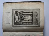 an old book with a drawing of a man and a woman