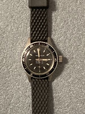 a watch that is sitting on top of a table