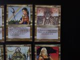 several cards of different characters are displayed on a black surface