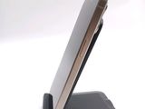 a cell phone that is sitting on top of a stand