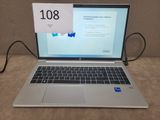 a laptop that is sitting on a table with a price tag attached to it