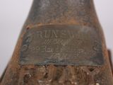 a close up of a rusted metal object on a table
