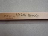 la photo d'un cadre en bois sur lequel figure une inscription