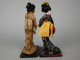 two figurines of two women dressed in traditional japanese clothing