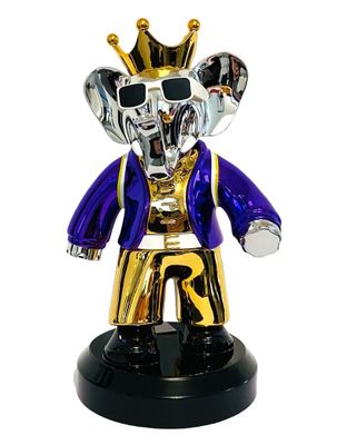 figurine d'éléphant royal violette et dorée sur un socle noir