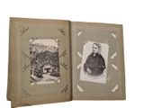 an old photo of a man sitting in a book