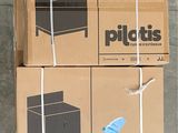 two boxes are tied up on the ground with a pair of scissors