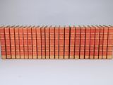 a stack of books sitting on top of each other on a table