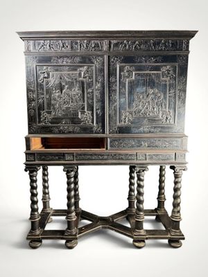 an old wooden cabinet with carvings on the doors and drawers