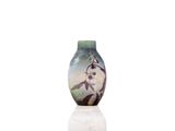 a vase that has a picture of a bird on it