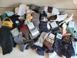 many pairs of socks that are sitting on a table