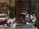 two vases sitting on top of a clear table
