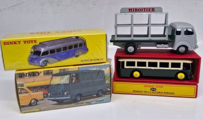 three boxed toy vehicles that are on top of each other