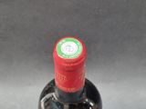 a bottle of wine that is sitting on a table