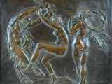 an image of a bronze plaque depicting three nudes in a circle