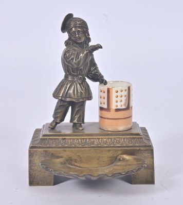 bronze figurine of a boy holding a cup on a wooden stand