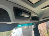 a view of the inside of a car with the sunroof