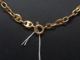 a close up of a gold chain necklace on a mannequin mannequin mannequin mannequin mannequin mannequin mannequin mann