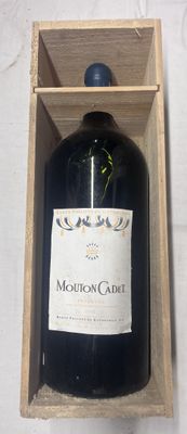 a bottle of wine in a wooden box on a table