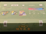 a green box with stickers on the inside of it