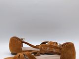 a close up of a pair of brown shoes on a white background