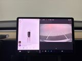 a laptop computer sitting on a desk in a car