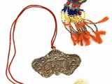 a necklace that has a picture of a person on it