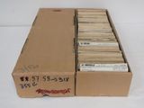 several boxes of old records are stacked on top of each other