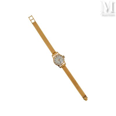une image d'une montre-bracelet en or avec un cadran blanc