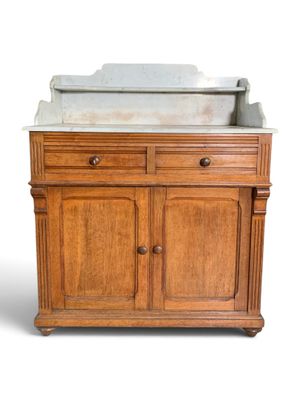 a wooden cabinet with a marble sink on top of it
