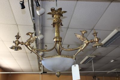 a chandelier that is hanging from the ceiling in a store