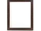 an old picture frame on a white wall with a white background