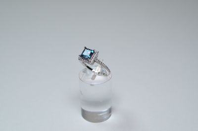 a ring that is sitting on top of a glass