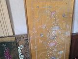 a picture of a painting on the wall next to other items