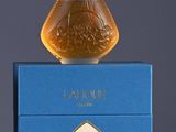 an image of a bottle of perfume sitting on top of a blue box