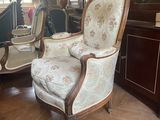 a chair that is sitting in the middle of a room