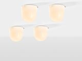 three light fixtures on a white surface with a white background