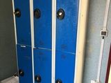 two blue lockers next to each other in a room