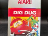 a box of atari ' s dig dug game on a table