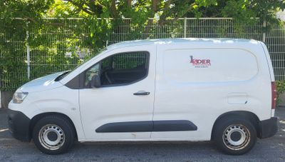 a white van that is parked in a parking lot