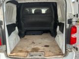 a white van with the back door open and the floor in the back