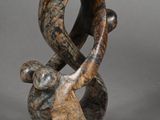 sculpture of an elephant holding a ring in its trunk