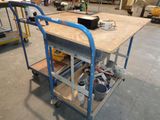 a cart with a work table on it in a warehouse