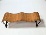 a bench made out of wood and metal on a white surface