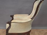 an old fashioned chair sitting on top of a wooden floor