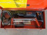 a tool box with a drill and other tools in it