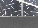 a picture of a window that has a lot of spikes on it